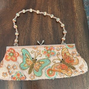 Cute butterfly clutch. No brand name.